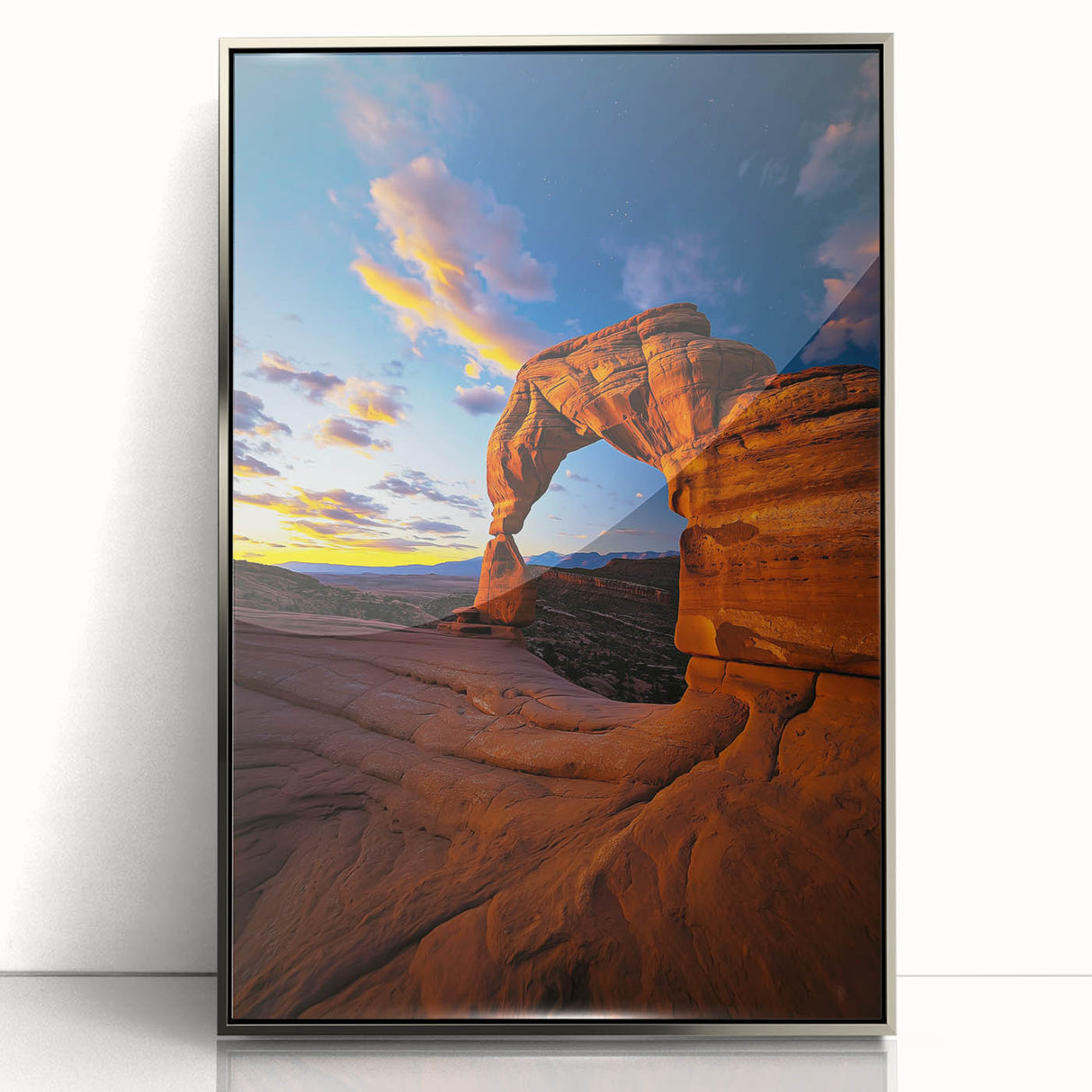 Framed acrylic artwork showcasing a stunning desert landscape, featuring golden sands, blue skies, and vibrant sunset hues, perfect for home decor.