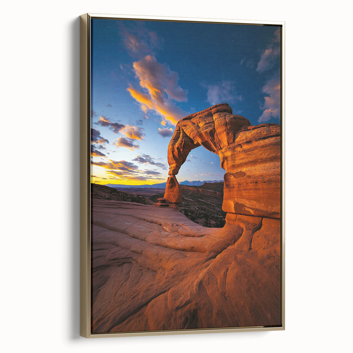Framed canvas artwork depicting a vibrant desert landscape with warm gold accents, showcasing rolling dunes under a clear blue sky, ideal for home decor.