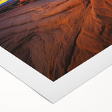 Desert landscape rolled canvas art showcasing vibrant hues of orange and gold, perfect for home decor, packaged securely in a durable cardboard tube.