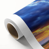 Vibrant rolled canvas print showcasing a scenic landscape of golden fields under a clear blue sky, elegantly packaged in a protective cardboard tube for easy transport.
