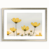 Textured abstract art print of close-up florals in muted green and white, framed in silver, ideal for bedroom art.