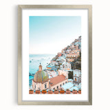 Textured abstract art print in warm orange and yellow tones, framed in silver, ideal for bedroom decor.