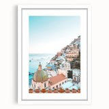 Abstract art print featuring swirling blue and green tones on a white framed canvas.