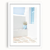 Abstract art print featuring swirling blue and green patterns on a white framed canvas.