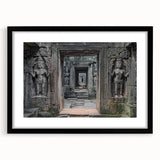 Black-framed landscape artwork featuring a serene castle scene with lush greenery and a blue sky, designed with a white mat for an elegant presentation.