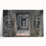 Stretched canvas artwork displaying a serene landscape featuring a majestic castle surrounded by lush greenery and a clear blue sky, ideal for home decor.