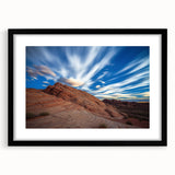 Framed landscape artwork depicting majestic cliffs in vibrant colors, accented with a black mat for a sophisticated finish, ideal for home or office decor.