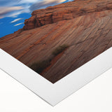 Vibrant rolled canvas artwork showcasing a stunning landscape of cliffs under a clear blue sky. Perfect for home decor, this piece adds a touch of nature's beauty.