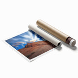 Majestic landscape print showcasing vibrant cliffs under a clear blue sky, rolled and packaged securely in a protective tube, ideal for home decor and art enthusiasts.