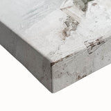 Close-up of a stretched canvas showcasing an abstract architectural wall art design with intricate geometric patterns in shades of blue and gray, ideal for modern decor.