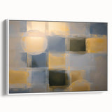 Abstract geometric framed canvas artwork showcasing a modern design in shades of white and gray, elegantly displayed from a side view against a minimalist backdrop.