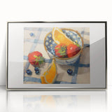 Mid-century modernist art featuring an array of fruits in vibrant colors on a silver-framed acrylic.