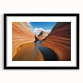 Framed landscape artwork of canyons in rich earthy tones, showcasing intricate details and textures, with a sleek black mat for an elegant presentation.