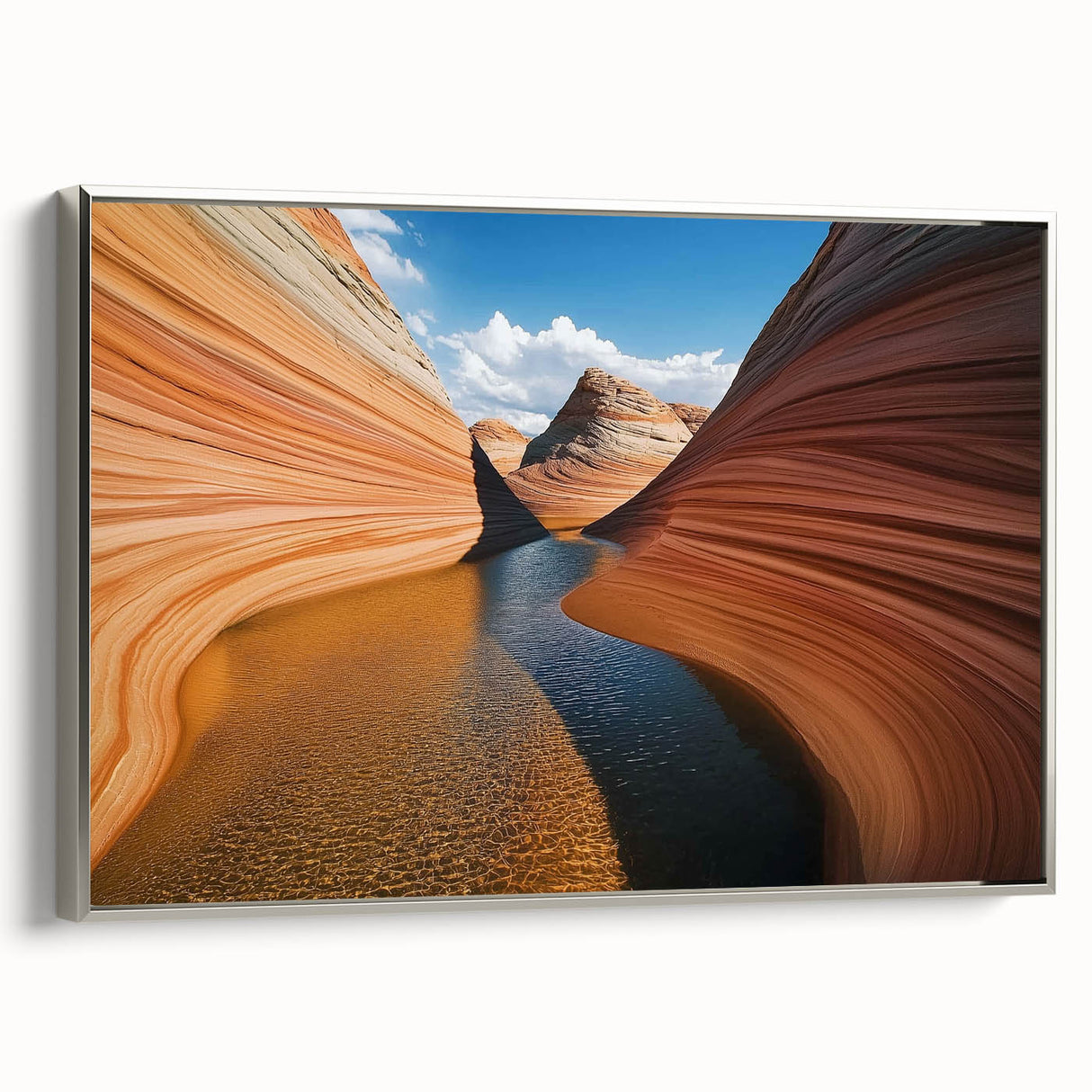 Framed canvas artwork depicting a stunning landscape of canyons, showcasing vibrant colors and intricate details, elegantly presented with a sleek silver frame.