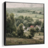 Framed landscape wall art depicting a serene countryside scene with lush green fields and a clear blue sky, presented in a sleek black frame, perfect for home decor.