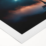 Rolled canvas artwork depicting a serene countryside landscape with vibrant green fields and a clear blue sky, ideal for home decor or art collection.