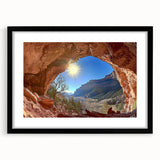 Framed desert landscape artwork in a sleek black frame with a white mat, showcasing vibrant colors and intricate details, perfect for modern home decor.