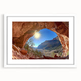 Framed desert landscape artwork featuring vibrant hues of orange and blue, set in a sleek white mat, perfect for home decor enhancement.