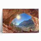 Desert landscape stretched canvas artwork featuring warm hues of orange and gold, leaning against a rustic wooden wall, ideal for home decor and art enthusiasts.