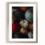 Abstract textured art in orange and brown shades, framed in silver, ideal for bedroom ambiance.