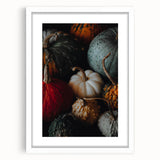 Abstract art print depicting autumnal trees in earth tones on a white framed canvas.