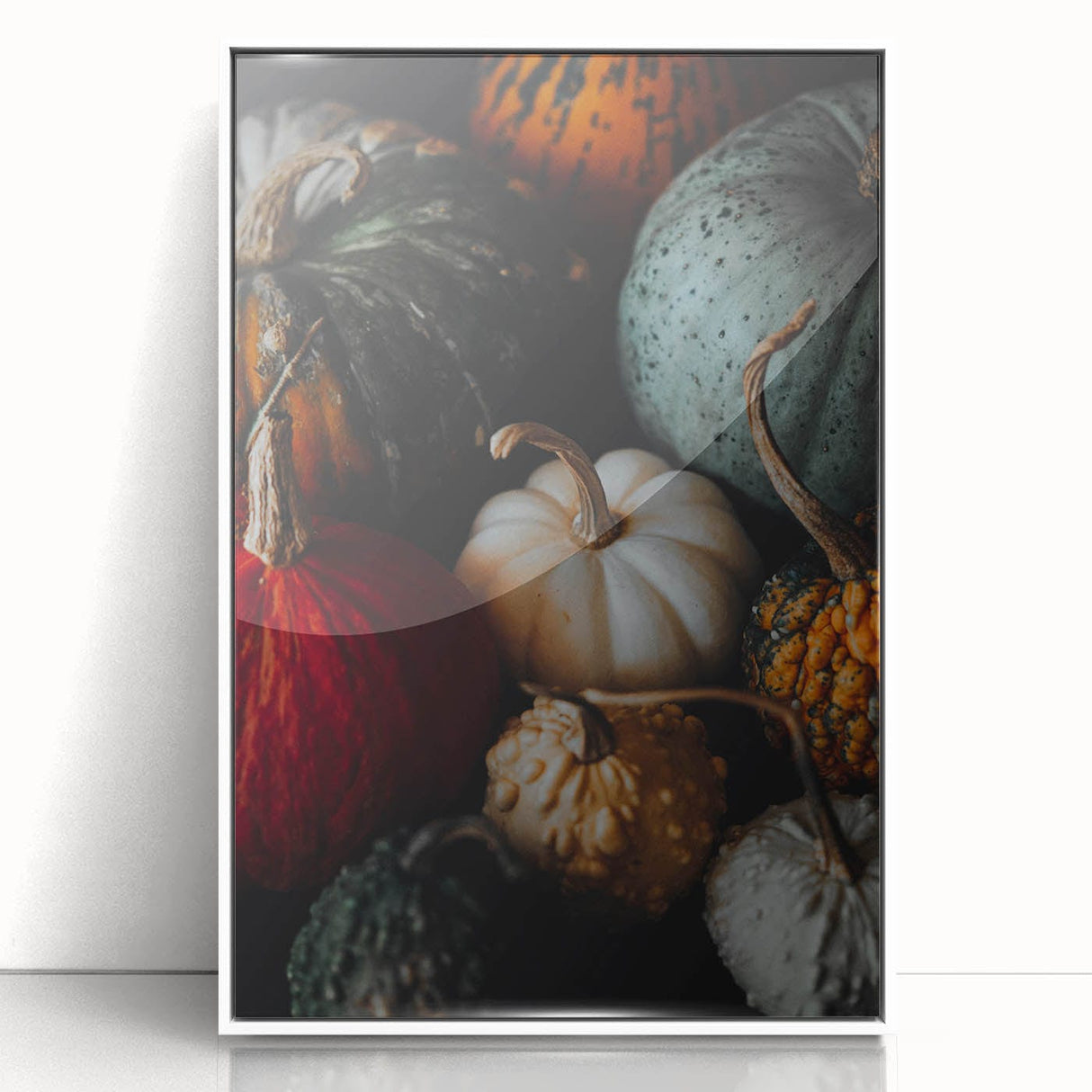 Art Deco style poster of an abstract fall scene in orange and brown tones, framed in white acrylic.