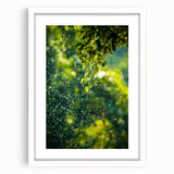 Abstract art print of spring season in soft green and yellow tones, framed in white.