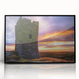 Framed acrylic print of a picturesque landscape featuring a majestic castle surrounded by lush greenery, presented in a sleek black frame, ideal for home decor.