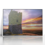 Framed acrylic artwork showcasing a picturesque landscape with a majestic castle under a clear blue sky, presented in a sleek white frame, ideal for home decor.