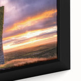 Close-up of a framed canvas artwork depicting a picturesque landscape with a majestic castle surrounded by lush greenery, showcasing vibrant colors and intricate details. Perfect for enhancing home decor and adding an elegant touch to any room.