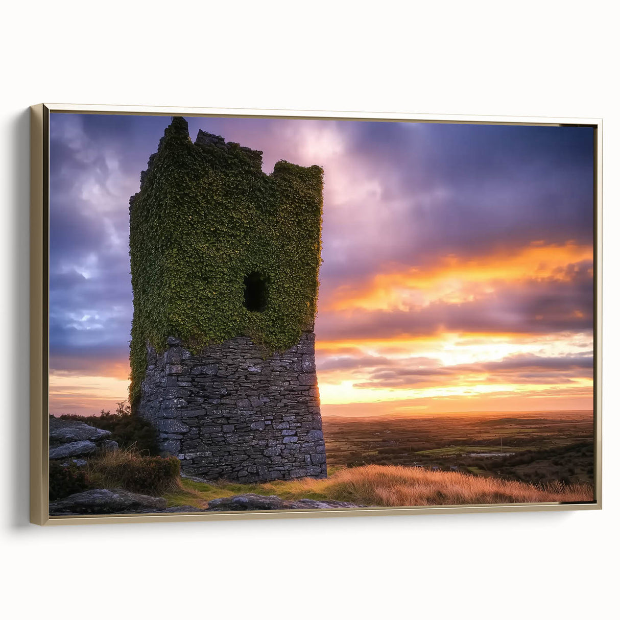 Framed canvas artwork showcasing a scenic landscape featuring a majestic castle surrounded by lush greenery, highlighted by a gold frame for an elegant touch.