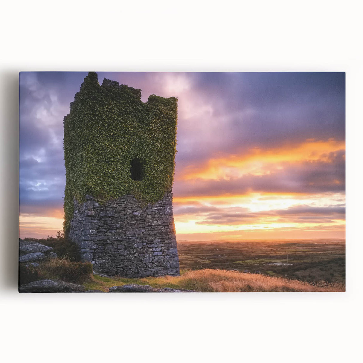 A vibrant stretched canvas depicting a picturesque landscape with a majestic castle nestled among lush green hills and a clear blue sky, ideal for home decor.