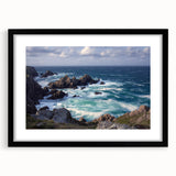 Framed landscape artwork showcasing dramatic cliffs in a serene natural setting, featuring a sleek black mat and frame, ideal for modern home decor.