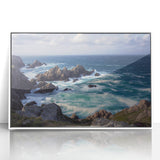 Framed acrylic landscape artwork depicting dramatic cliffs and vibrant skies, showcased in a sleek white frame, ideal for modern home decor.