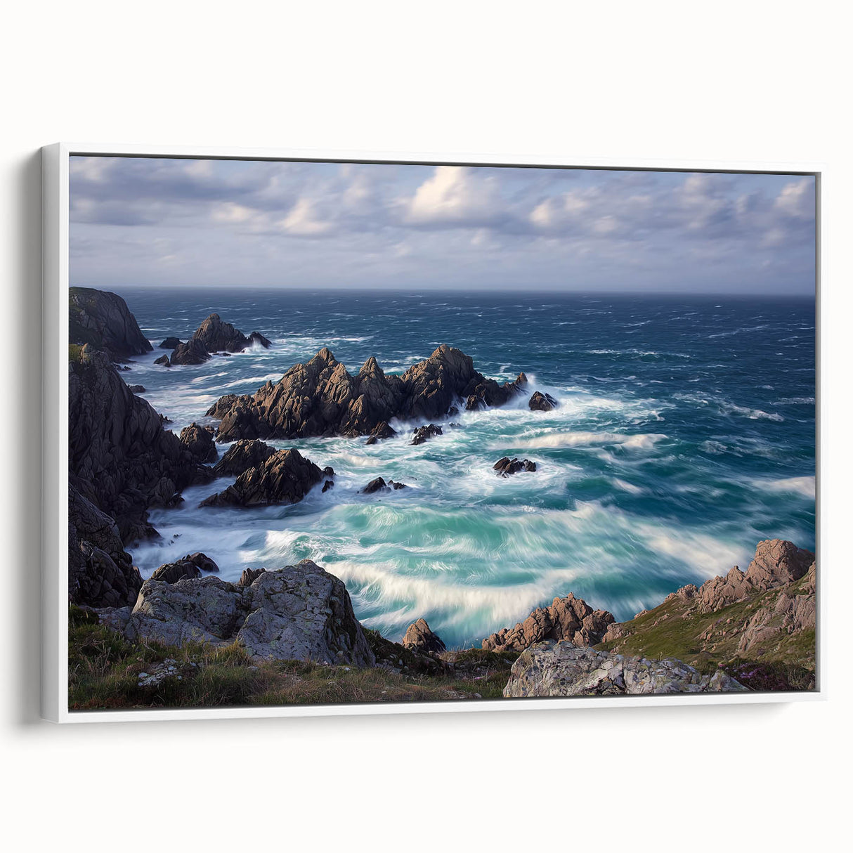 Framed canvas artwork showcasing a dramatic cliff landscape in vibrant colors, displayed from a side view against a white background, perfect for home decor.