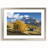 Silver-framed landscape artwork showcasing a scenic barn view, elegantly matted for a polished presentation, perfect for home decor enthusiasts.