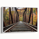 Framed canvas artwork depicting a serene landscape bridge scene, showcasing rich greens and blues, set against a white background for a modern aesthetic.