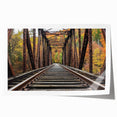 Rolled print showcasing a stunning landscape bridge scene, featuring vibrant colors and intricate details, packaged securely in a protective cardboard tube. Ideal for home or office decor.