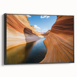 Framed canvas artwork depicting a stunning landscape of canyons with rich earth tones, featuring a sleek black frame, perfect for enhancing modern decor and art collections.