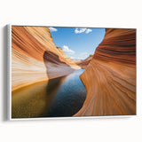 Framed canvas artwork depicting a stunning landscape of colorful canyons, showcasing vibrant reds and ochres, with a sleek white frame adding elegance to home decor.