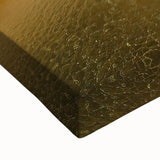 Close-up view of a stretched canvas artwork depicting a vibrant landscape of canyons, showcasing rich earthy tones and intricate textures, ideal for home decor.