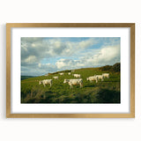Elegant gold-framed landscape artwork featuring a serene countryside scene with lush greenery and rolling hills, ideal for enhancing home decor.