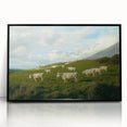 Framed acrylic landscape artwork depicting a serene countryside scene, featuring vibrant green fields and a clear blue sky, presented in a sleek black frame.