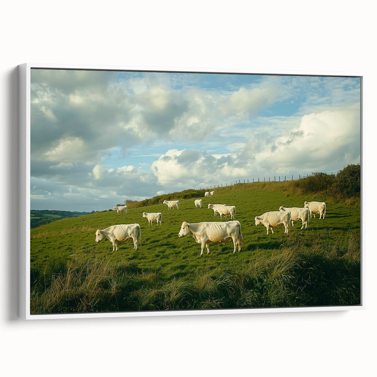 Framed canvas artwork depicting a serene countryside landscape with lush green fields and rolling hills, showcased from a white side view, perfect for home decor.