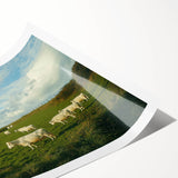 Rolled print showcasing a vibrant countryside landscape design with rolling hills and a clear blue sky, packaged securely in a protective cardboard tube for safe delivery.