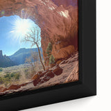 Close-up of a framed canvas artwork depicting a vibrant desert landscape with warm hues of orange and yellow, showcasing detailed textures and natural elements. Ideal for home decor enthusiasts seeking a striking focal point.