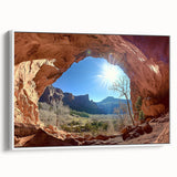 Framed canvas artwork depicting a serene desert landscape with warm tones of orange and brown, showcasing a white frame and side profile view ideal for home decor.