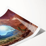 Desert landscape rolled print showcasing vibrant orange and yellow hues, featuring abstract mountain silhouettes and a serene sky, perfect for home decor.