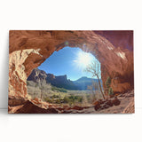 Desert landscape canvas print showcasing vibrant orange and yellow hues, elegantly leaning against a neutral wall, perfect for modern home decor.