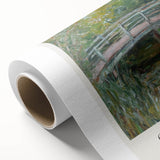 Rolled canvas print showcasing a vibrant landscape design with rich colors, featuring rolling hills and a sunset sky, securely packaged in a protective tube.